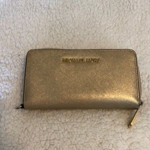 Gold Michael Kors smartphone wallet